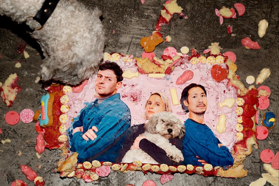 Tomas Coleman, Molly Wilkof and Derek Man Lui on a cake